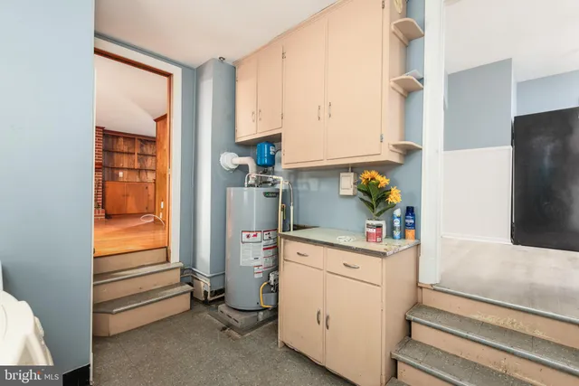 a kitchen with a refrigerator and cabinets