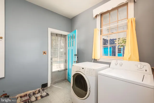 a utility room with dryer and washer