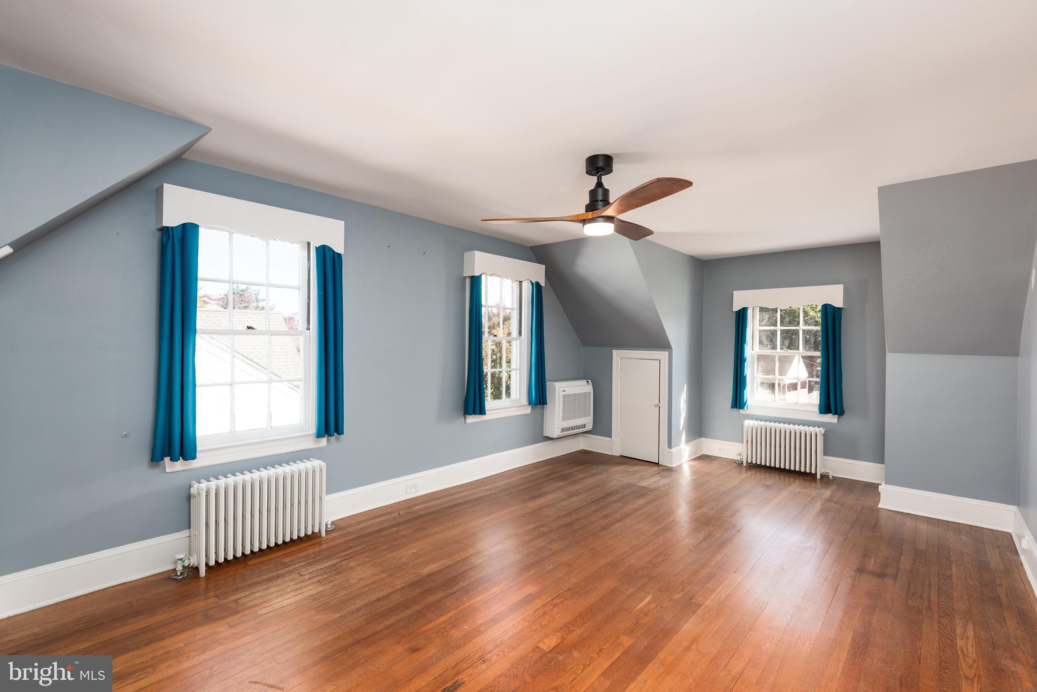 107 Rambler Road Cambridge, MD 21613 - Photo 19 of 28 a view of an empty room with wooden floor and a window
