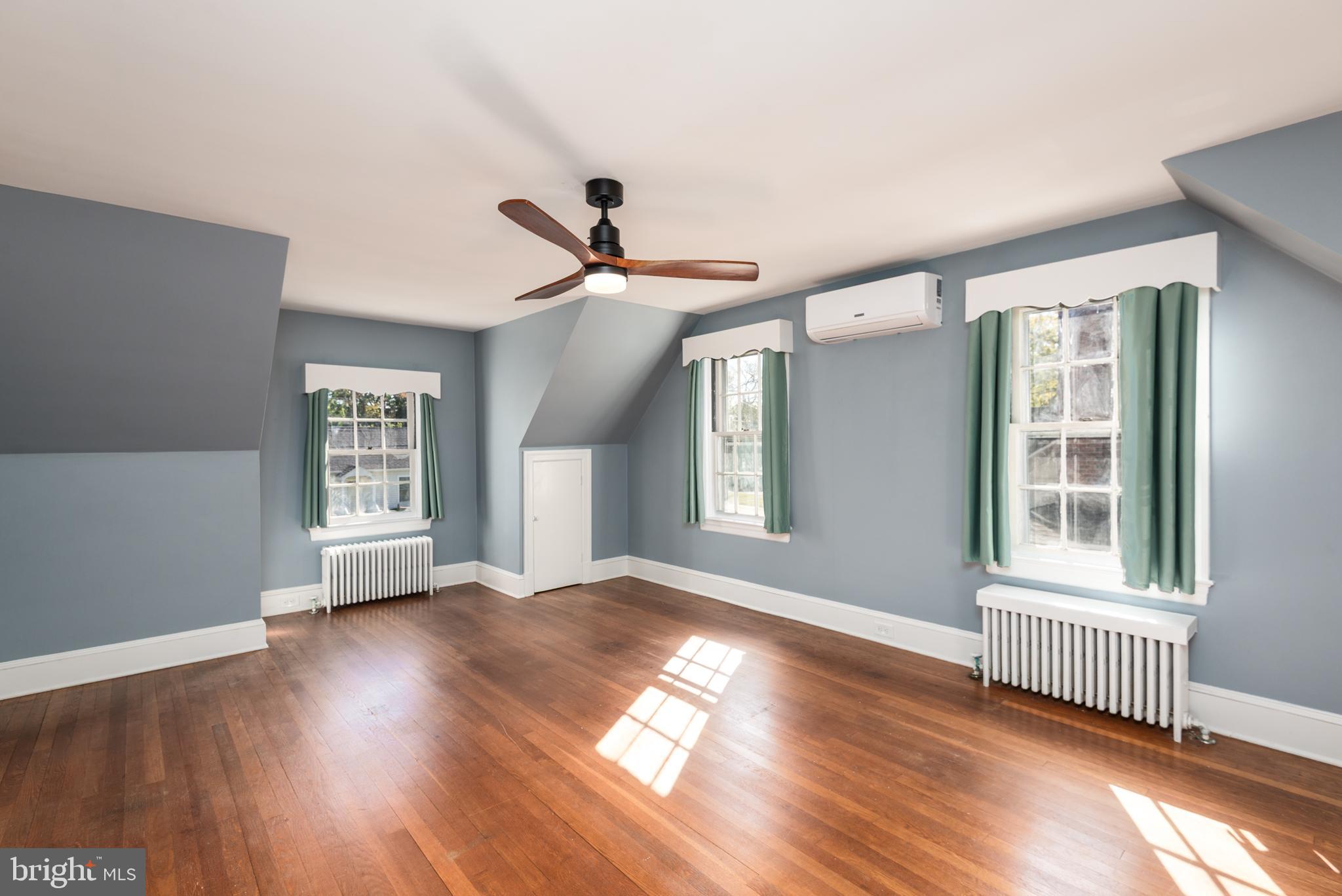 107 Rambler Road Cambridge, MD 21613 - Photo 20 of 28 a view of an empty room with wooden floor and a window