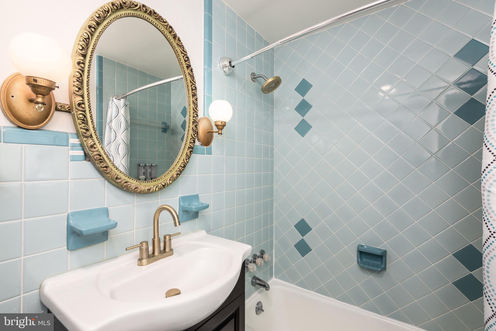 107 Rambler Road Cambridge, MD 21613 - Photo 24 of 28 a bathroom with a sink a mirror and a mirror
