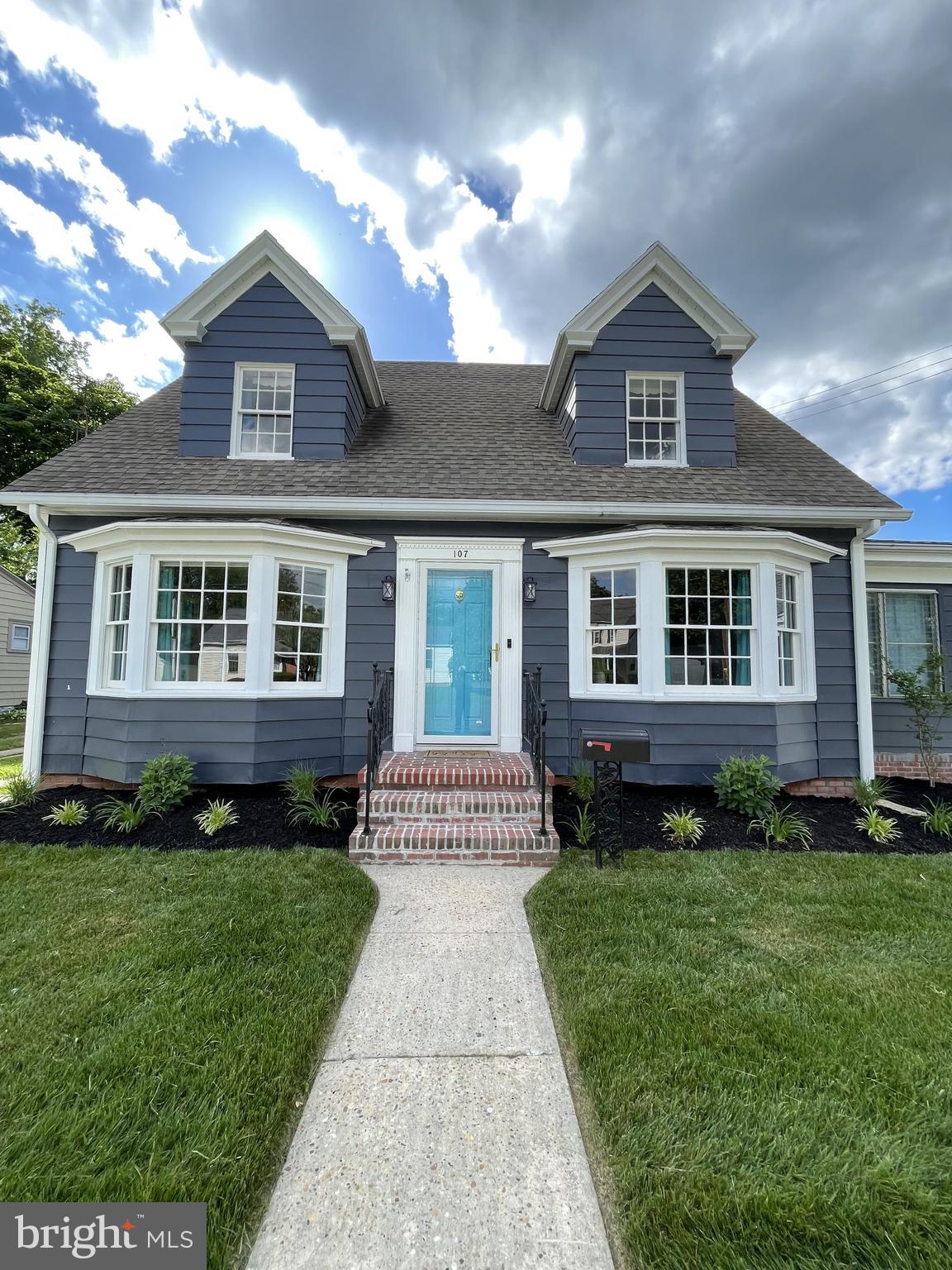 107 Rambler Road Cambridge, MD 21613 - Photo 3 of 28 a front view of a house with a yard and outdoor seating