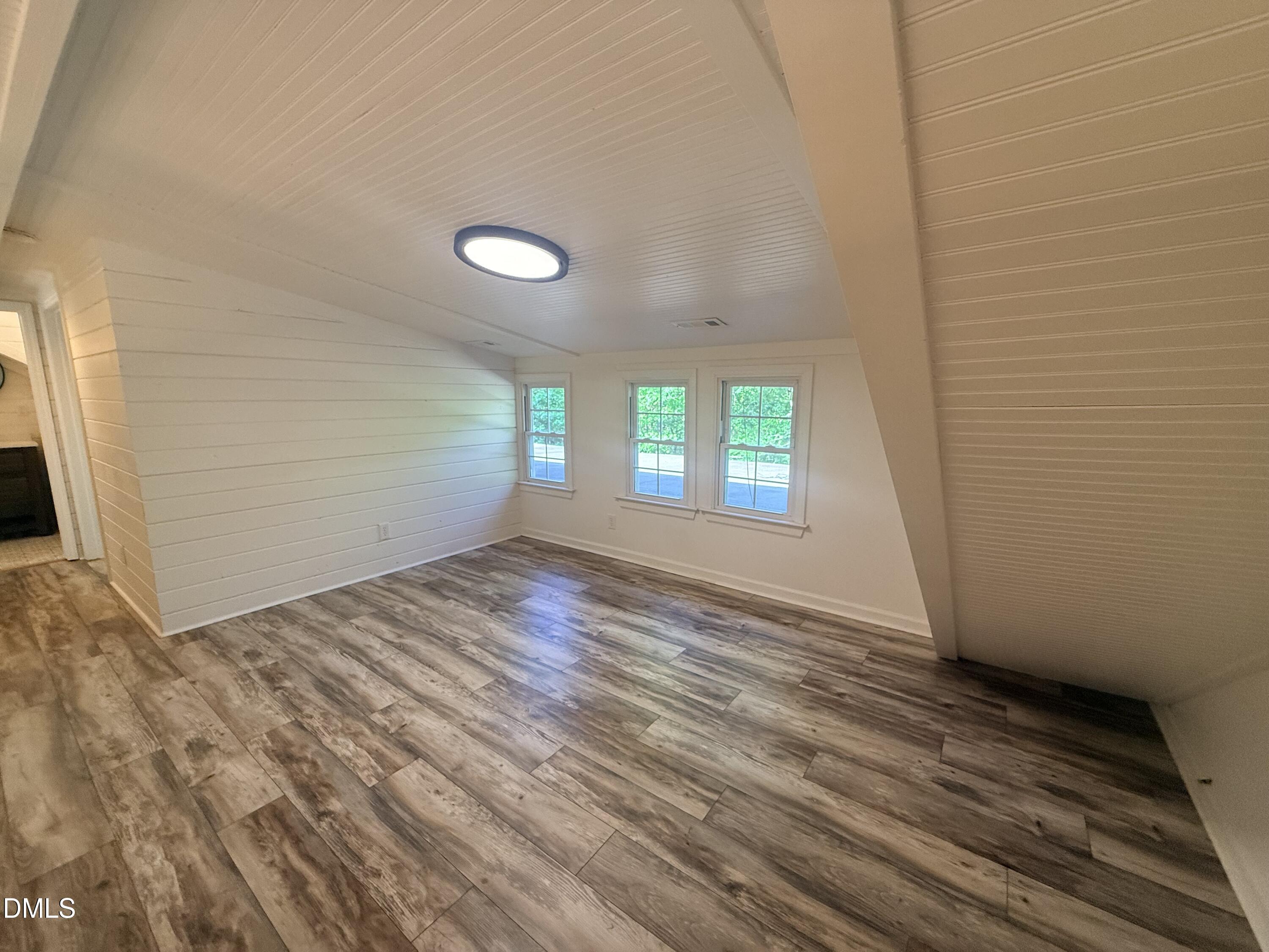 327 Shady Oak Road Roxboro, NC 27574 - Photo 49 of 62 a view of wooden floor and windows in a room