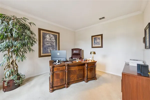 a view of a workspace with furniture