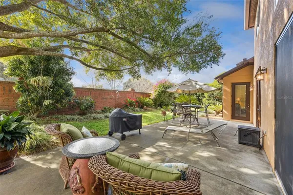 a view of an outdoor sitting area with furniture