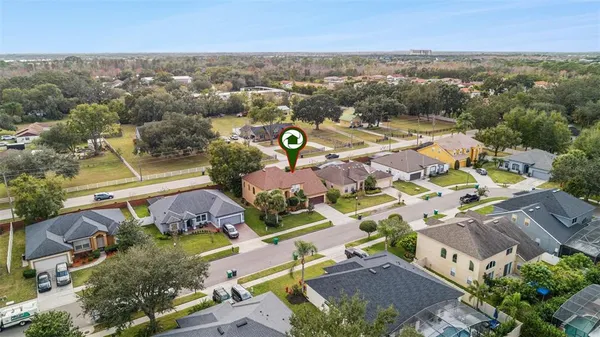 an aerial view of residential houses with outdoor space