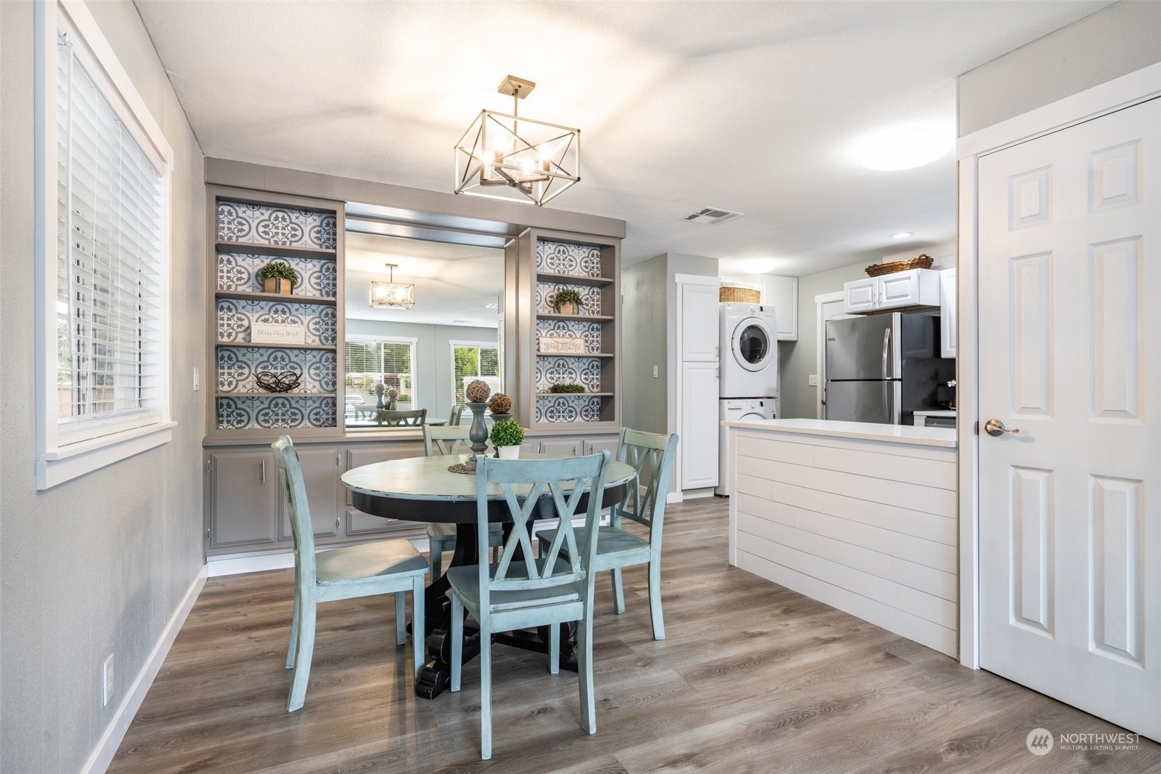 2302 R Street Southeast, Unit 12 Auburn, WA 98002 - Photo 14 of 34 a view of a dining room with furniture window and wooden floor