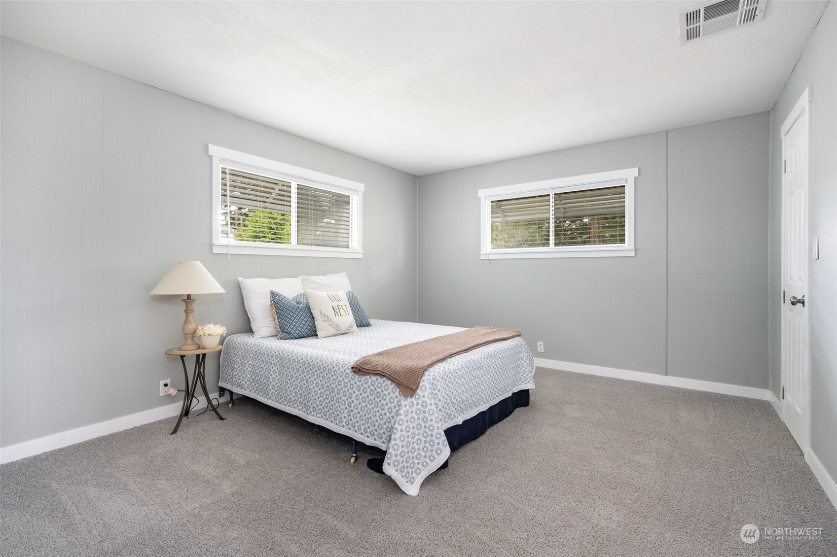 2302 R Street Southeast, Unit 12 Auburn, WA 98002 - Photo 15 of 34 a spacious bedroom with a bed and a window