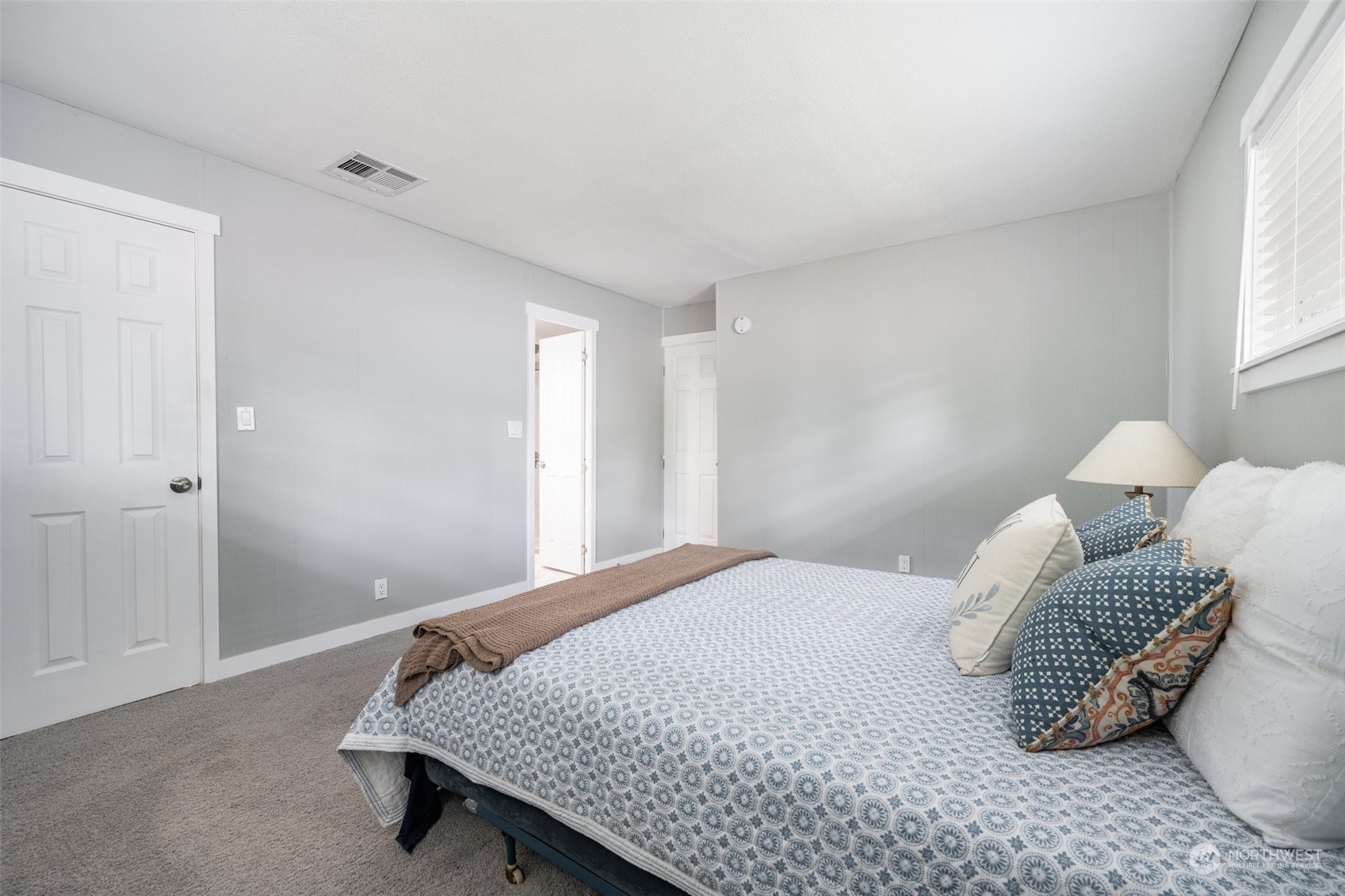 2302 R Street Southeast, Unit 12 Auburn, WA 98002 - Photo 16 of 34 a bedroom with a bed and a window