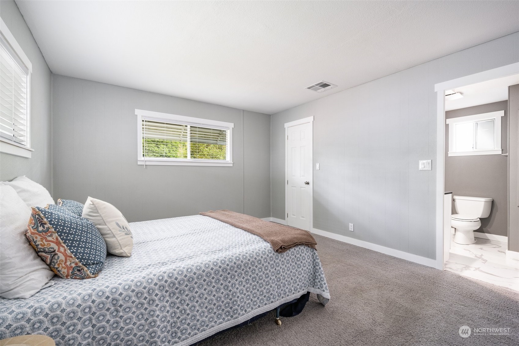 2302 R Street Southeast, Unit 12 Auburn, WA 98002 - Photo 17 of 34 a bedroom with a bed and a window