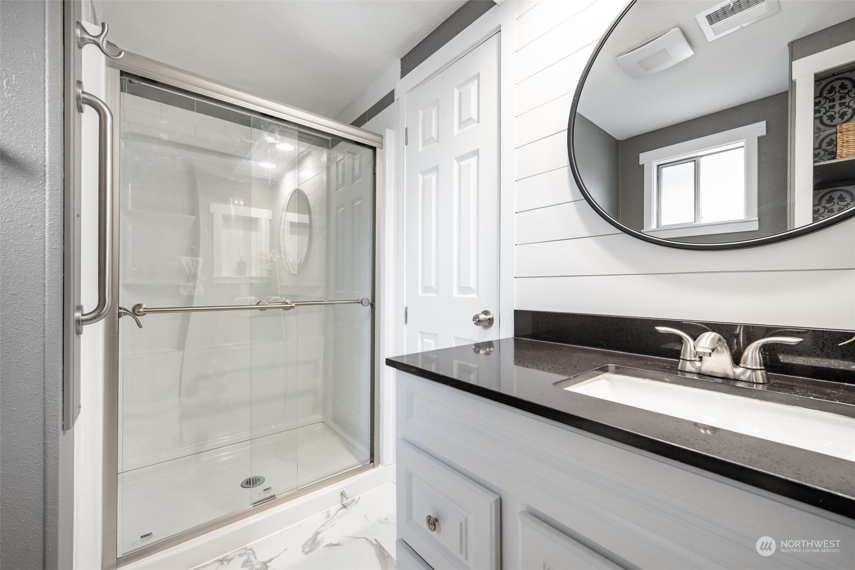 2302 R Street Southeast, Unit 12 Auburn, WA 98002 - Photo 20 of 34 a bathroom with a sink and a mirror