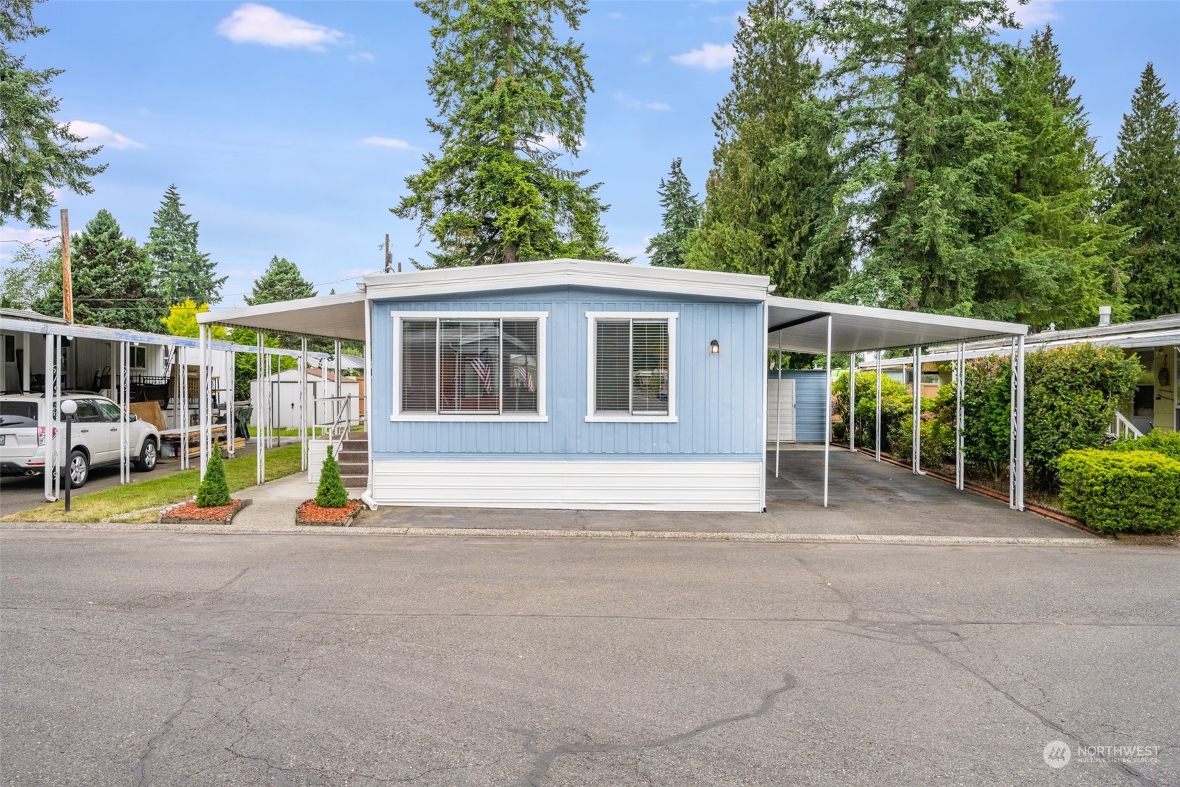 2302 R Street Southeast, Unit 12 Auburn, WA 98002 - Photo 2 of 34 a view of house with outdoor space and porch