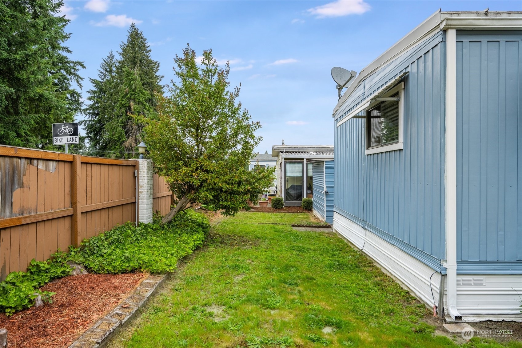 2302 R Street Southeast, Unit 12 Auburn, WA 98002 - Photo 26 of 34 a front view of a house with garden