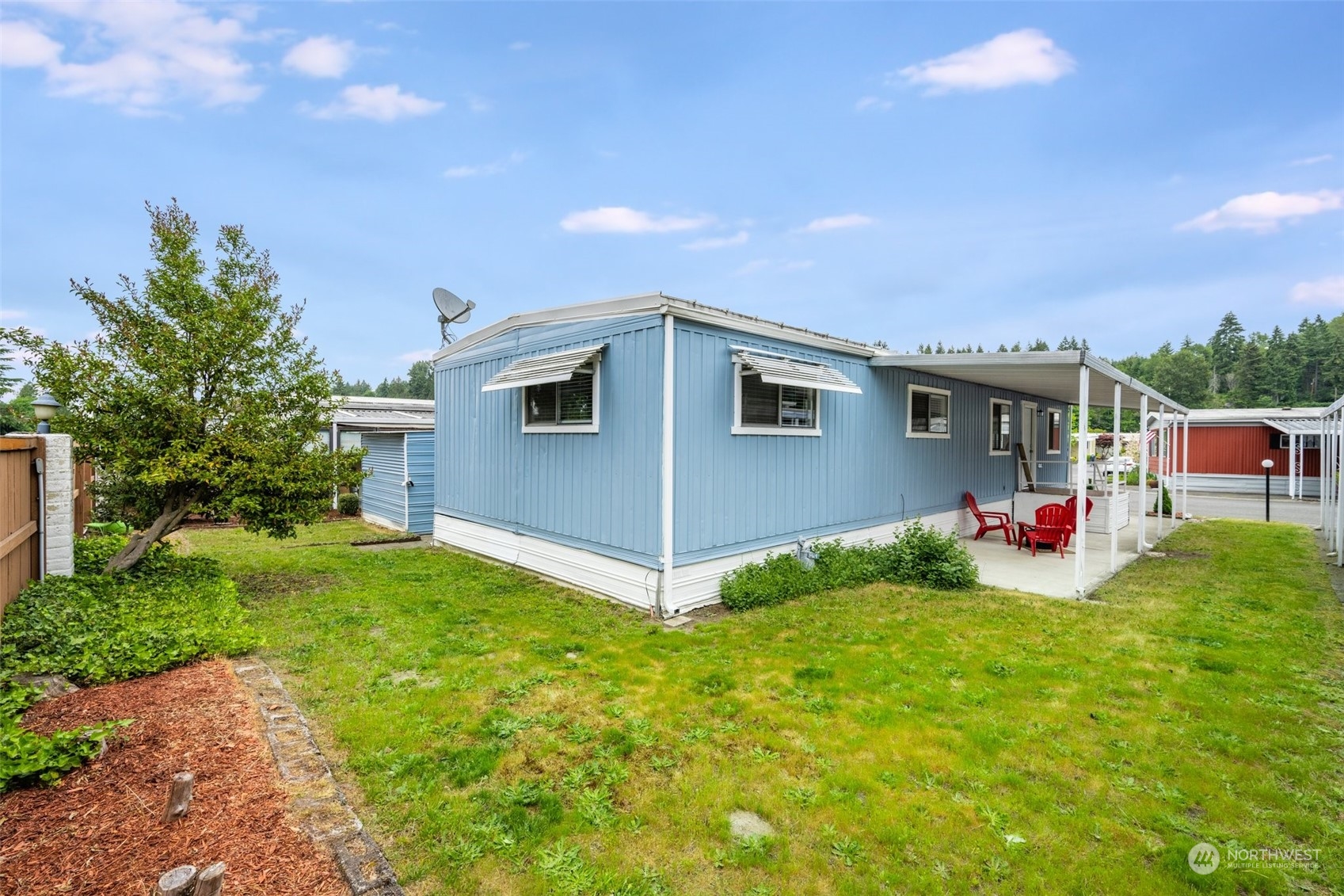 2302 R Street Southeast, Unit 12 Auburn, WA 98002 - Photo 27 of 34 a view of a backyard of the house