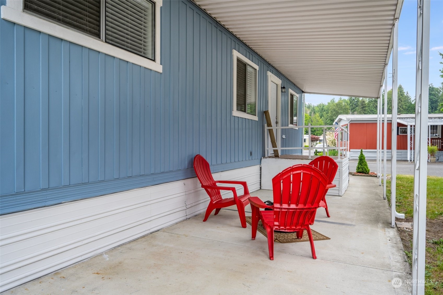 2302 R Street Southeast, Unit 12 Auburn, WA 98002 - Photo 28 of 34 a outdoor space with patio the couches and pool table with chairs