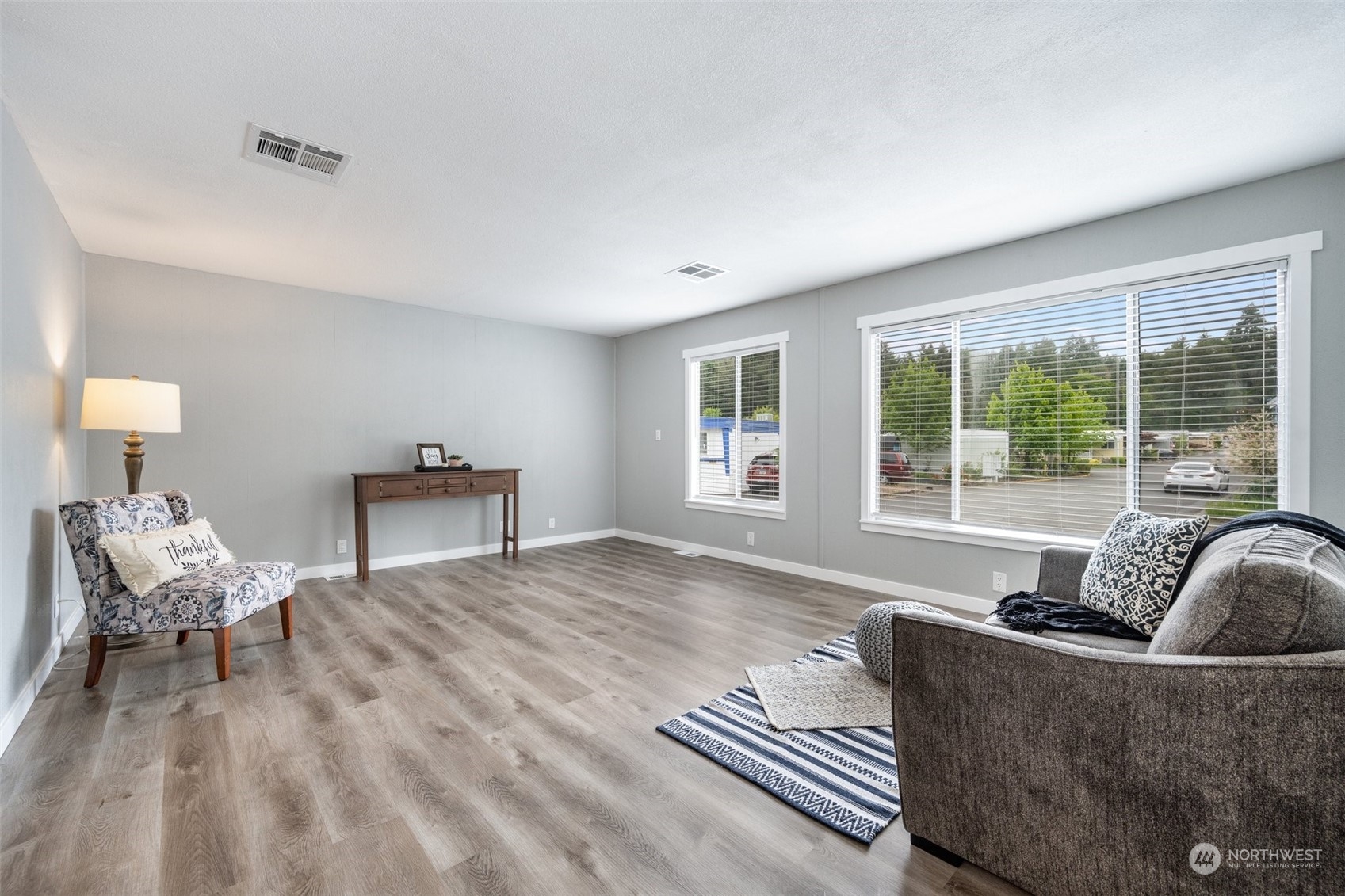 2302 R Street Southeast, Unit 12 Auburn, WA 98002 - Photo 3 of 34 a living room with furniture and a large window