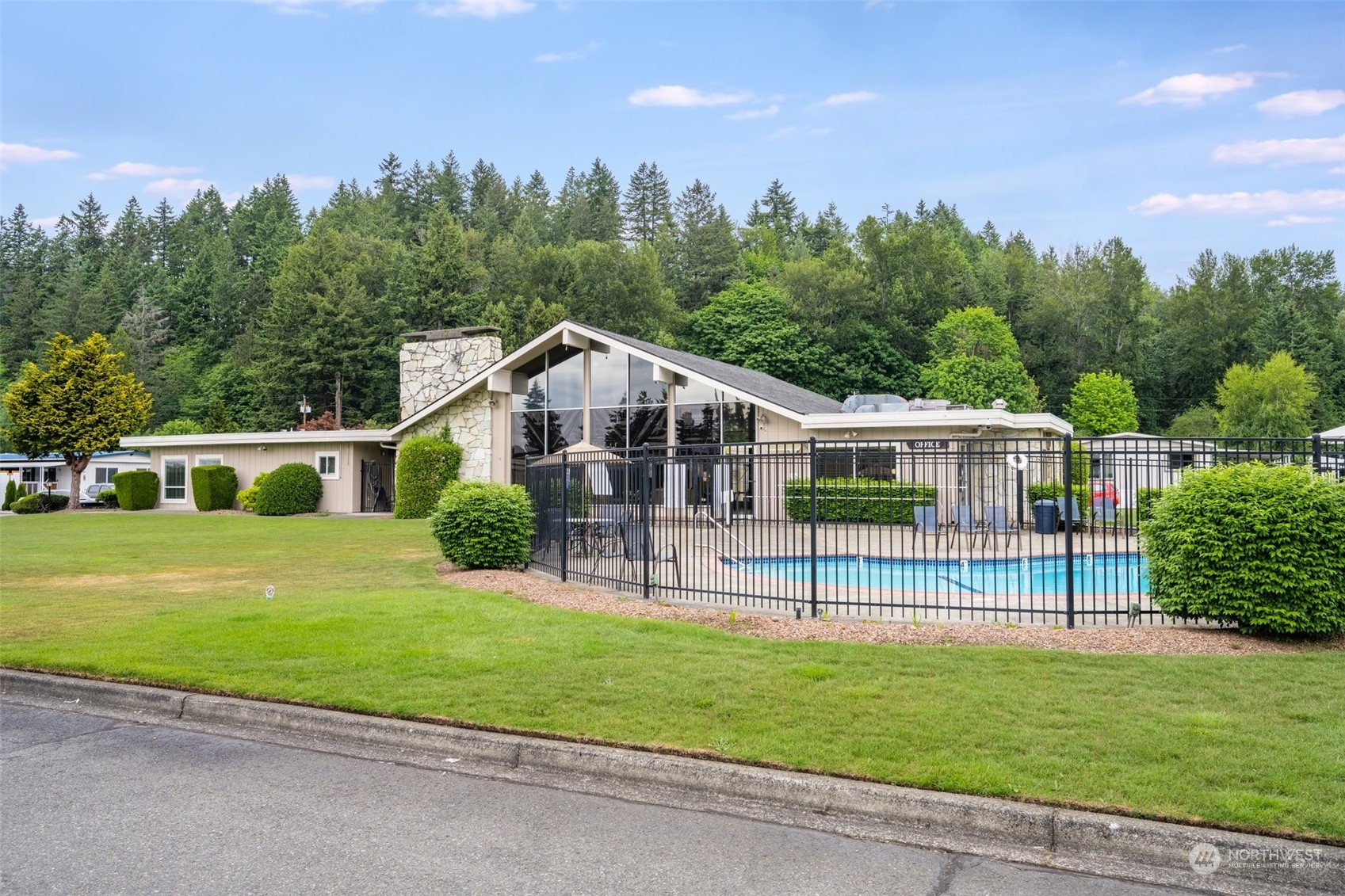 2302 R Street Southeast, Unit 12 Auburn, WA 98002 - Photo 32 of 34 a view of a house with a yard and a garden