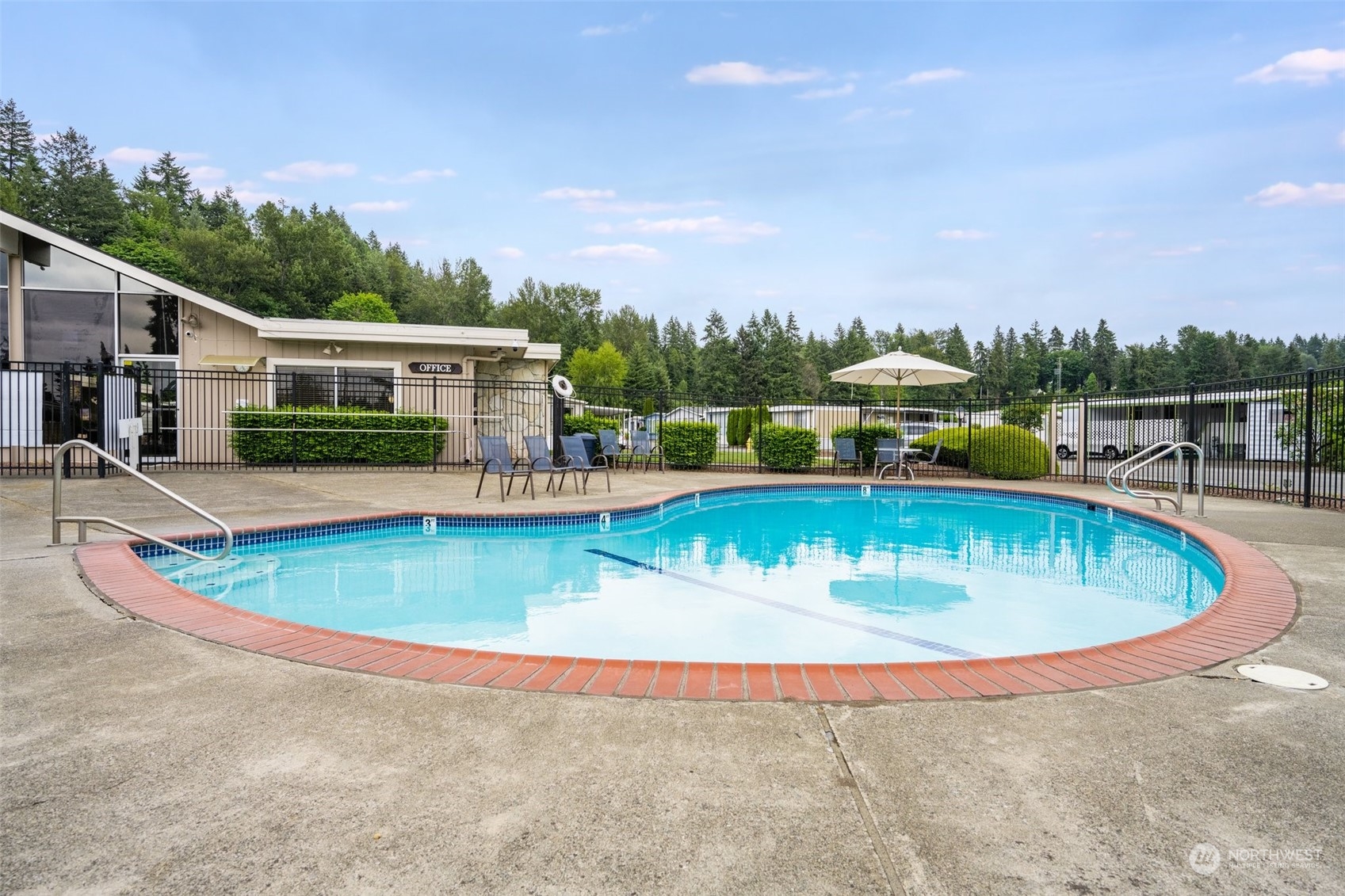 2302 R Street Southeast, Unit 12 Auburn, WA 98002 - Photo 33 of 34 an aerial view of a house with swimming pool and yard