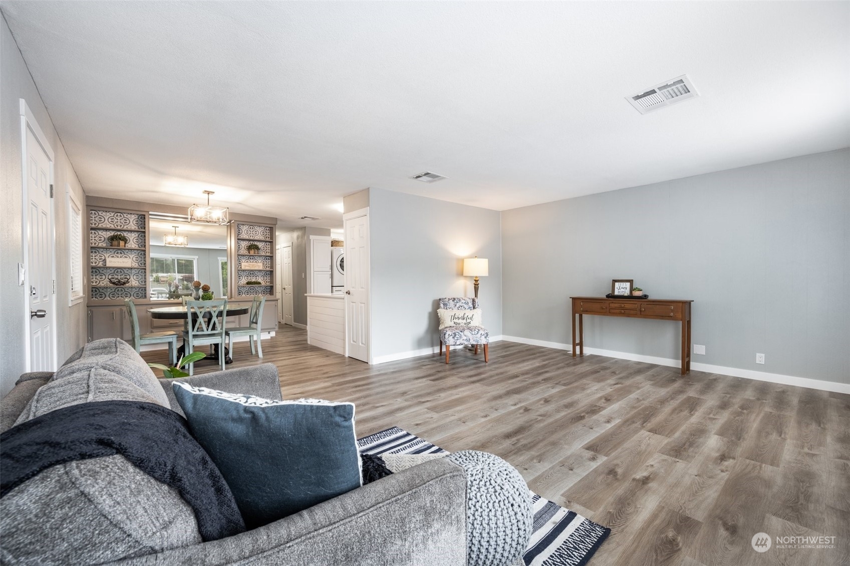 2302 R Street Southeast, Unit 12 Auburn, WA 98002 - Photo 4 of 34 a living room with furniture and a table