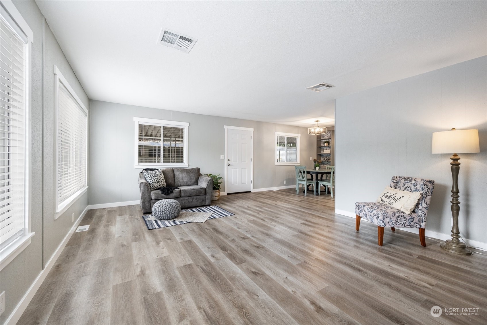 2302 R Street Southeast, Unit 12 Auburn, WA 98002 - Photo 5 of 34 a living room with furniture and a wooden floor