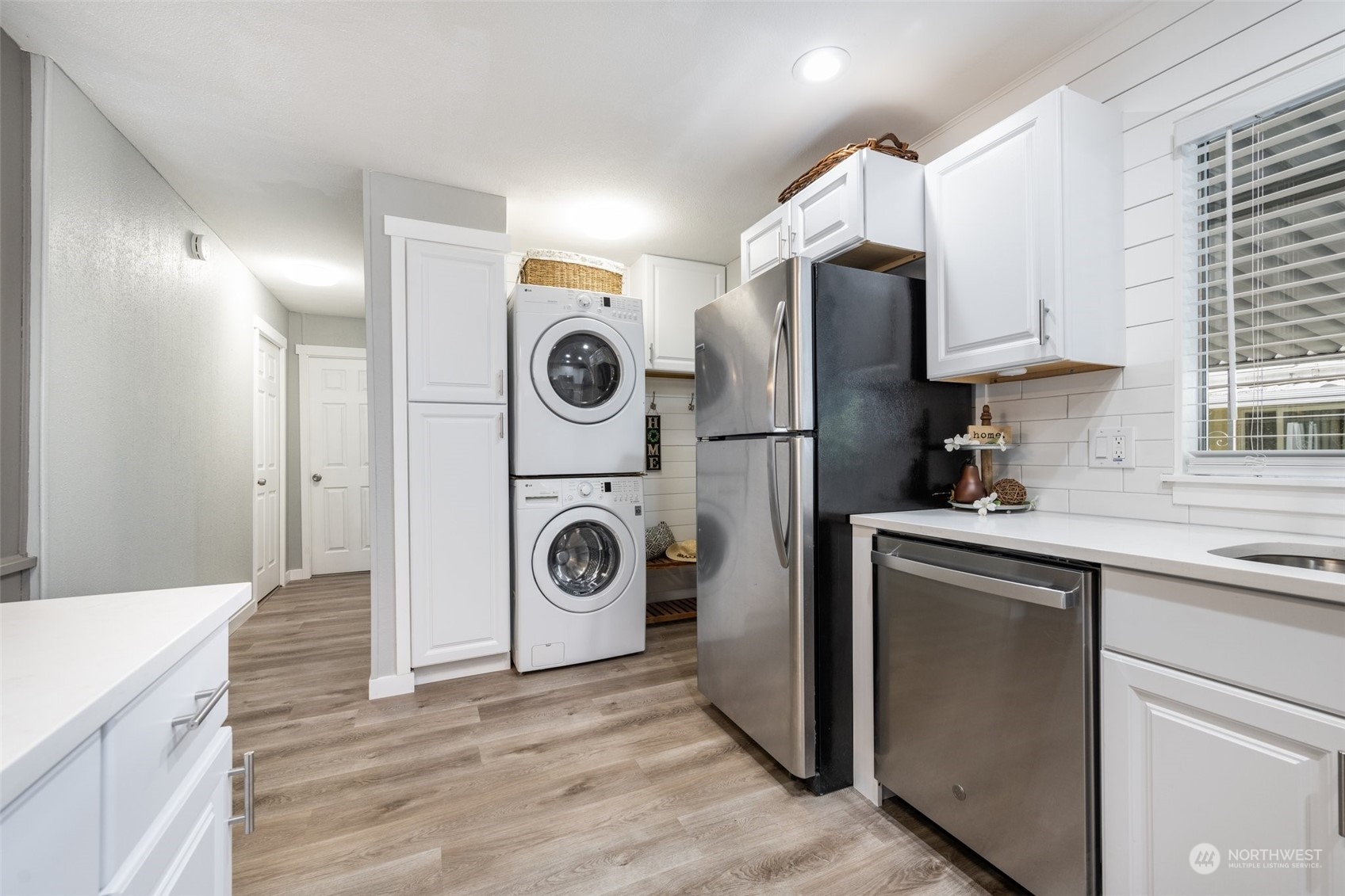 2302 R Street Southeast, Unit 12 Auburn, WA 98002 - Photo 10 of 34 a kitchen with a refrigerator sink and cabinets