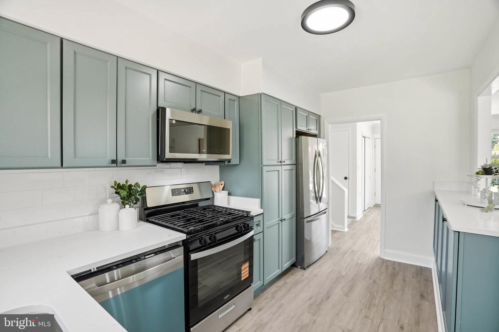 1004 Flagtree Lane Baltimore, MD 21208 - Photo 13 of 28 Quartz counters & new soft close cabinetry