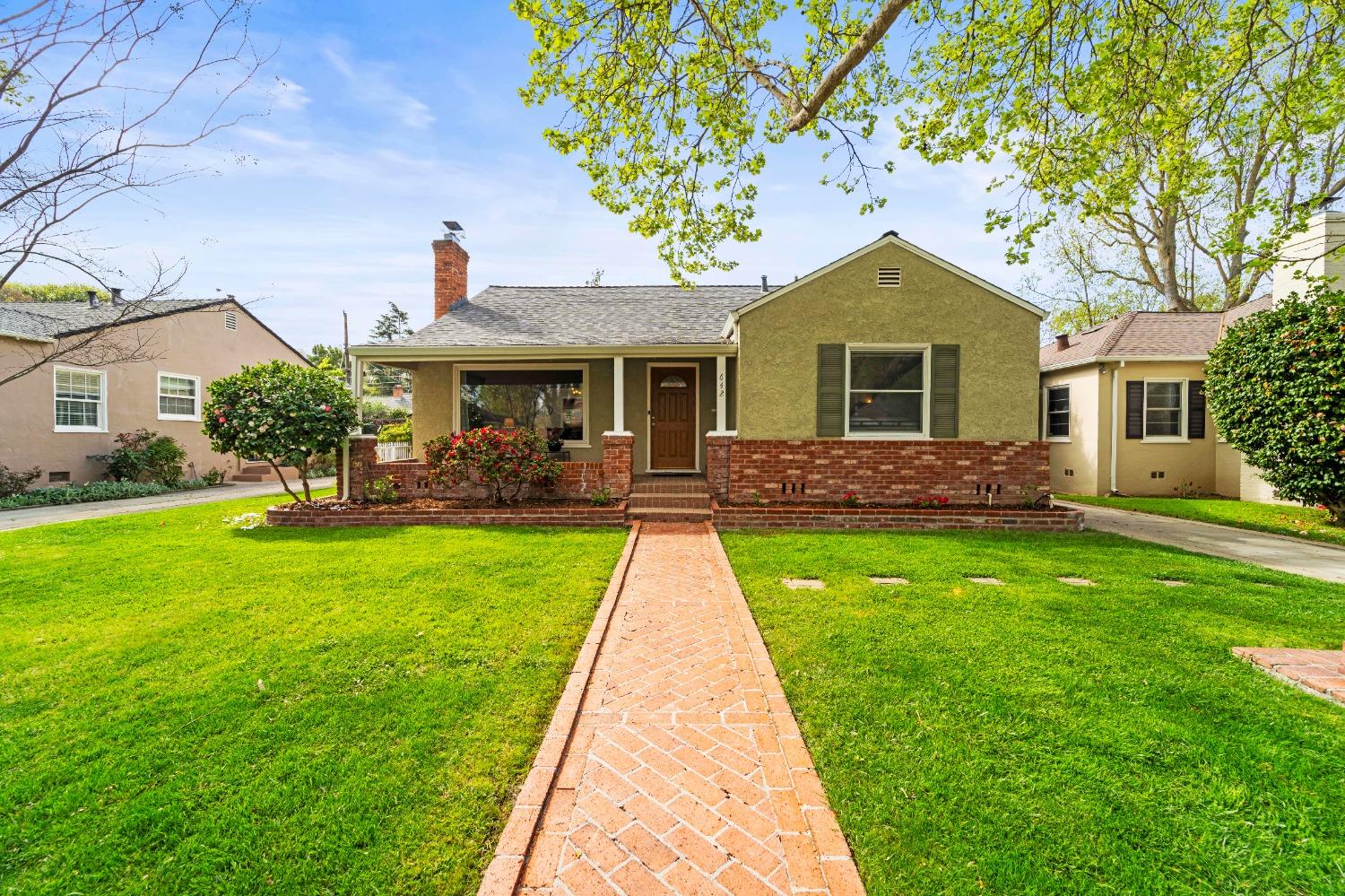 642 Perkins Way Sacramento, CA 95818 - Photo 1 of 1 a front view of a house with garden