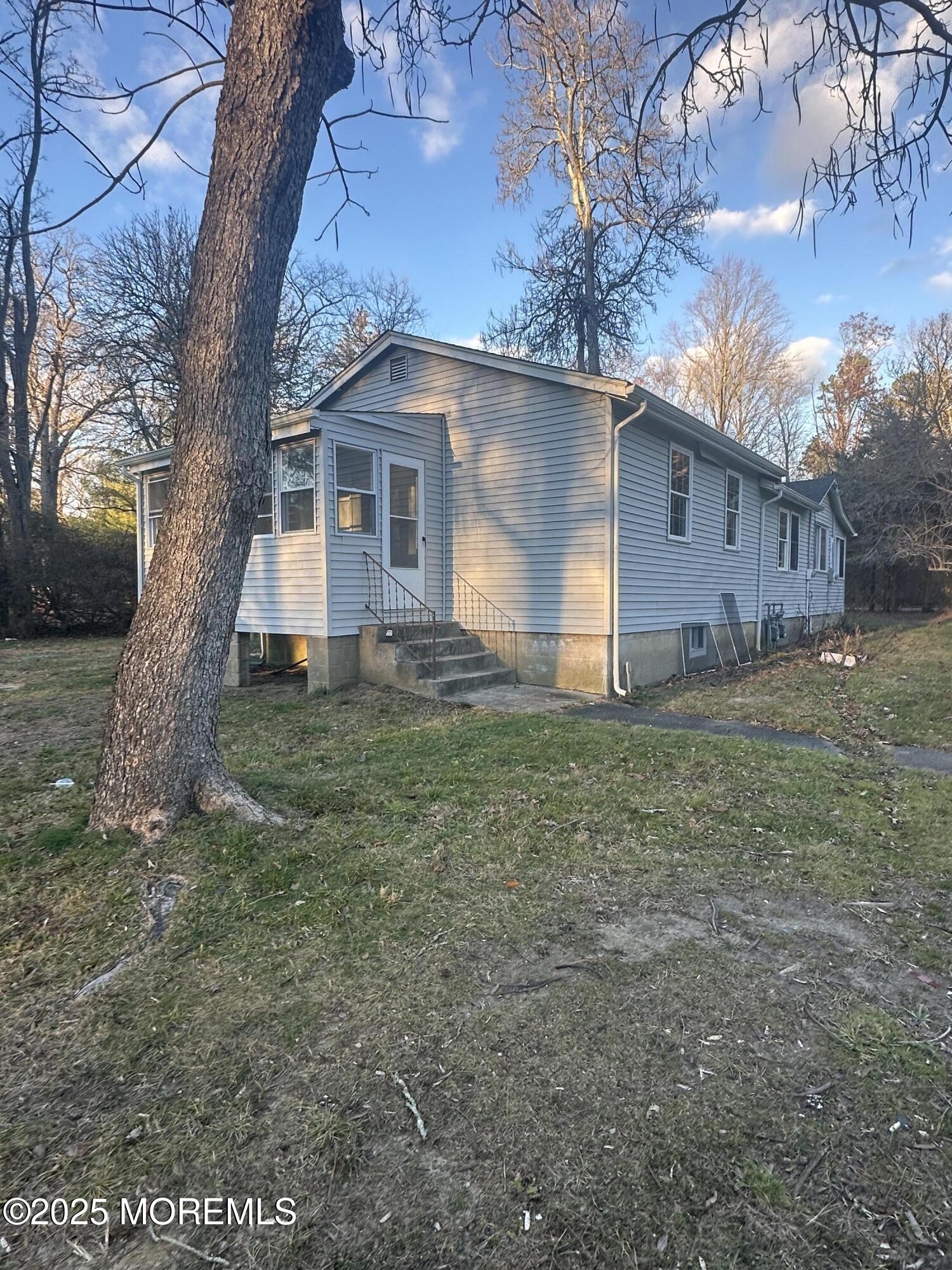 240 Perrineville Road Jackson, NJ 08527 - Photo 2 of 12 a view of a house with a yard