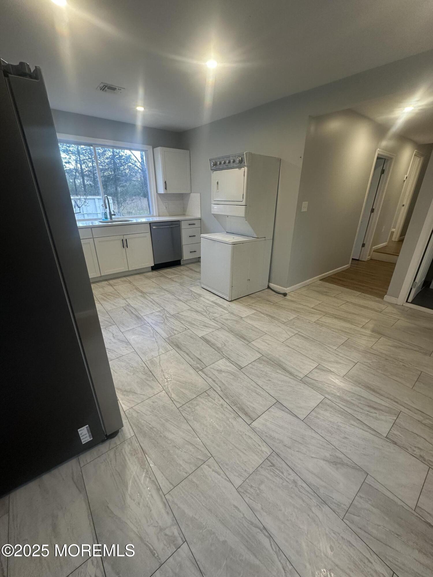 240 Perrineville Road Jackson, NJ 08527 - Photo 5 of 12 a view of an empty room with a fireplace