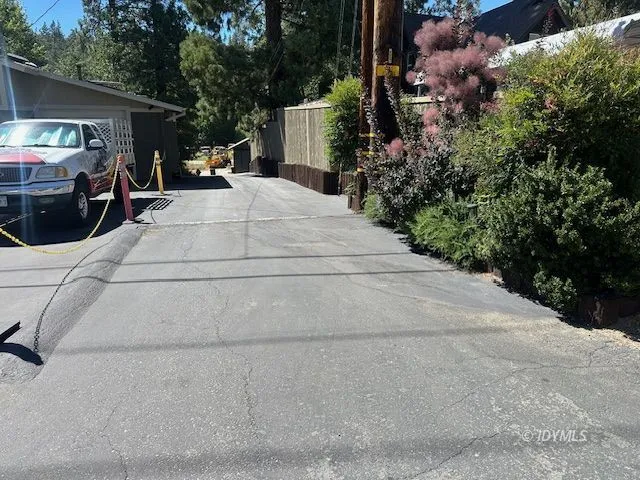 a view of a house with a yard covered in snow
