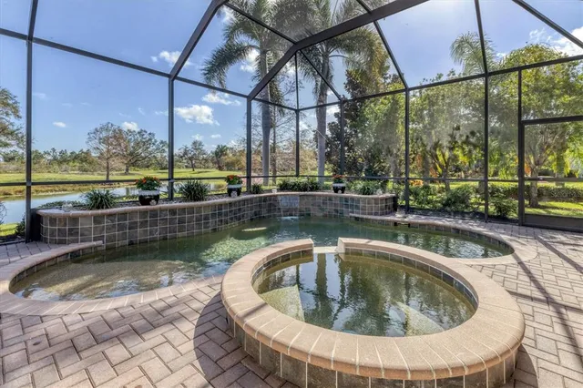 an aerial view of multiple houses with a yard