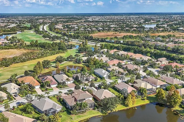 a view of a swimming pool with a table and chairs