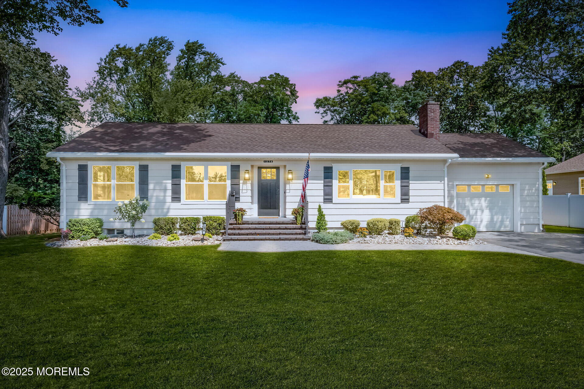 1276 West Front Street Lincroft, NJ 07738 - Photo 1 of 66 a front view of a house with a garden