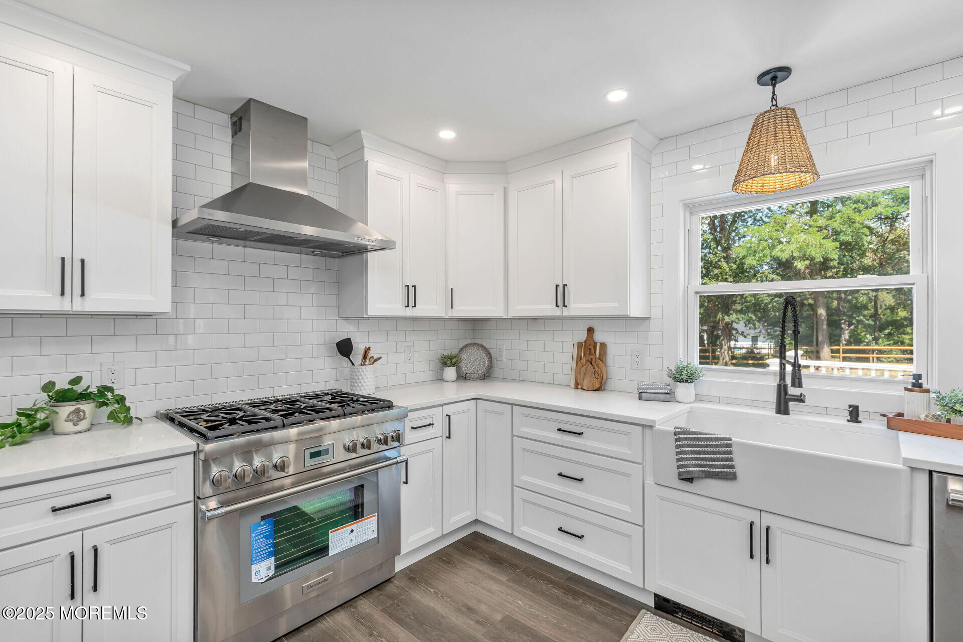 1276 West Front Street Lincroft, NJ 07738 - Photo 16 of 66 a kitchen with white cabinets and appliances