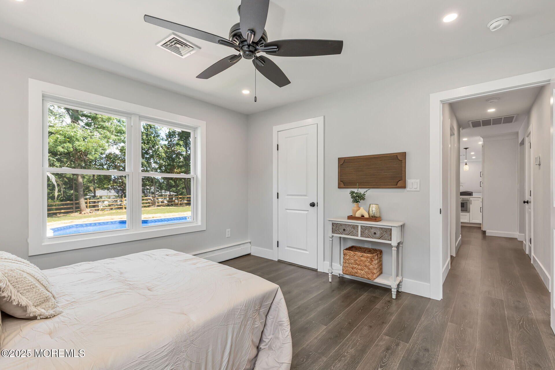 1276 West Front Street Lincroft, NJ 07738 - Photo 21 of 66 a bedroom with a bed and a flat screen tv