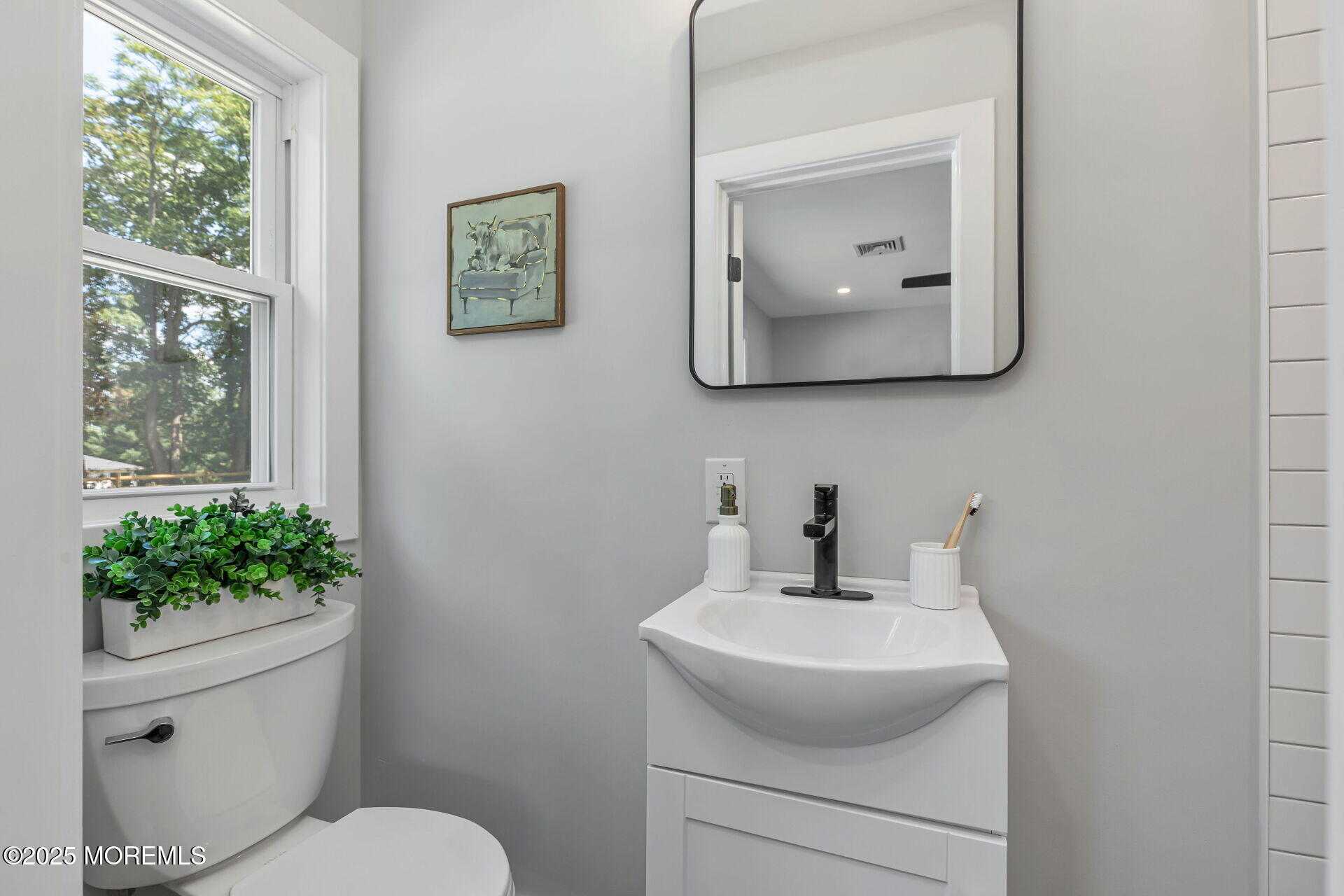 1276 West Front Street Lincroft, NJ 07738 - Photo 22 of 66 a bathroom with a toilet sink and mirror