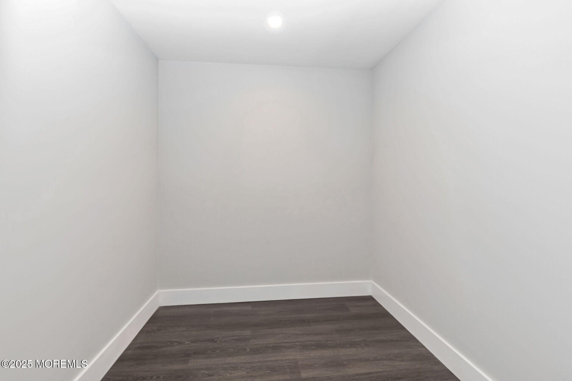 1276 West Front Street Lincroft, NJ 07738 - Photo 38 of 66 a view of an empty room with wooden floor