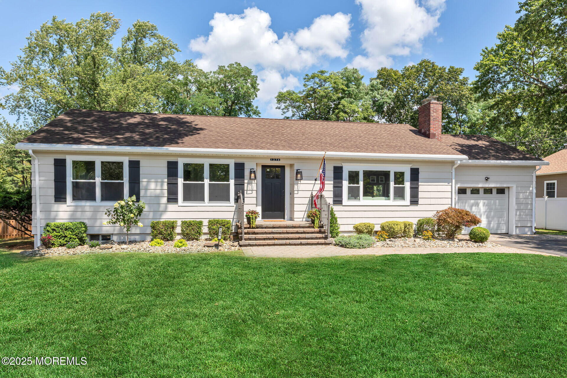 1276 West Front Street Lincroft, NJ 07738 - Photo 40 of 66 a front view of a house with a yard and green space