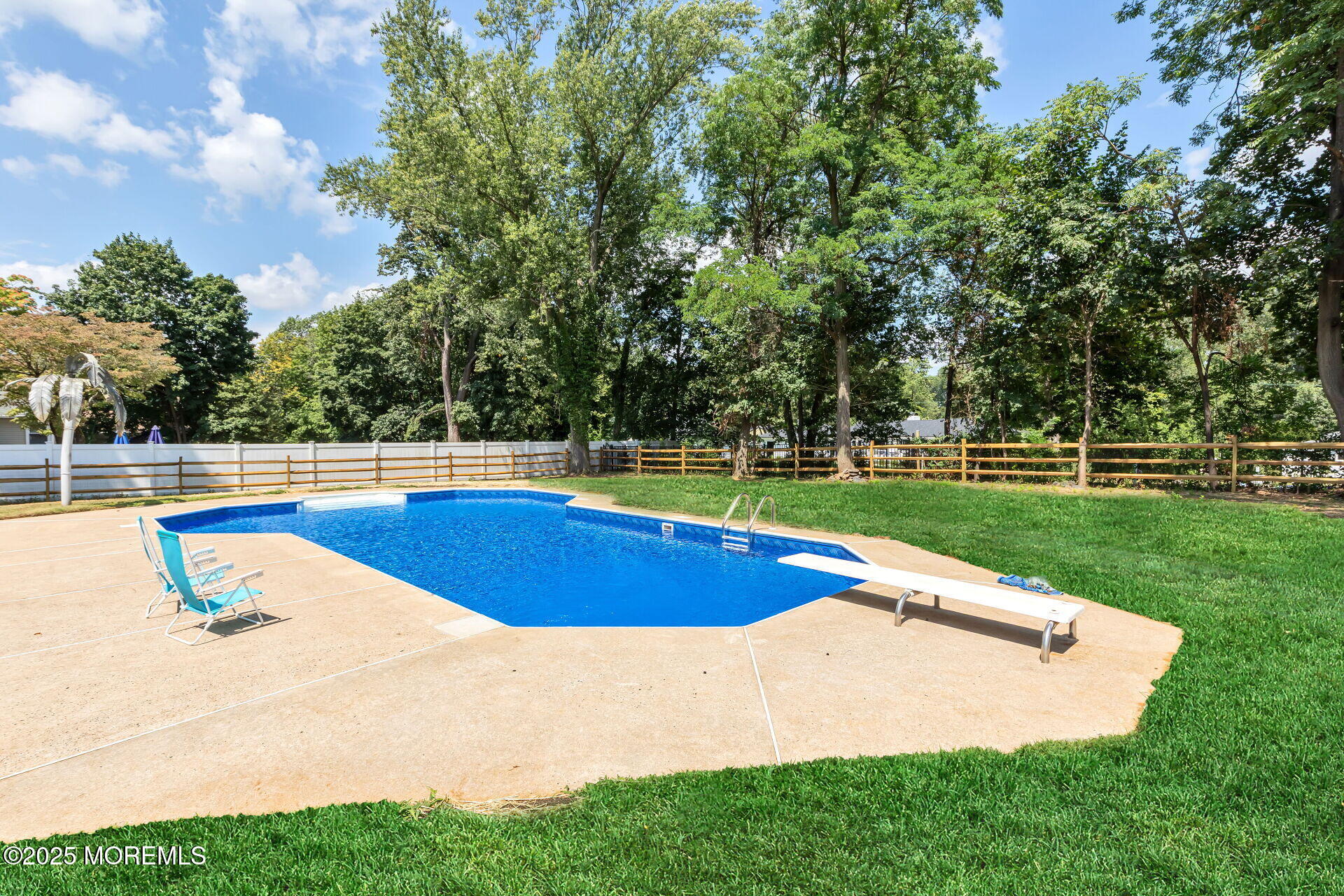 1276 West Front Street Lincroft, NJ 07738 - Photo 42 of 66 a view of a swimming pool with a yard