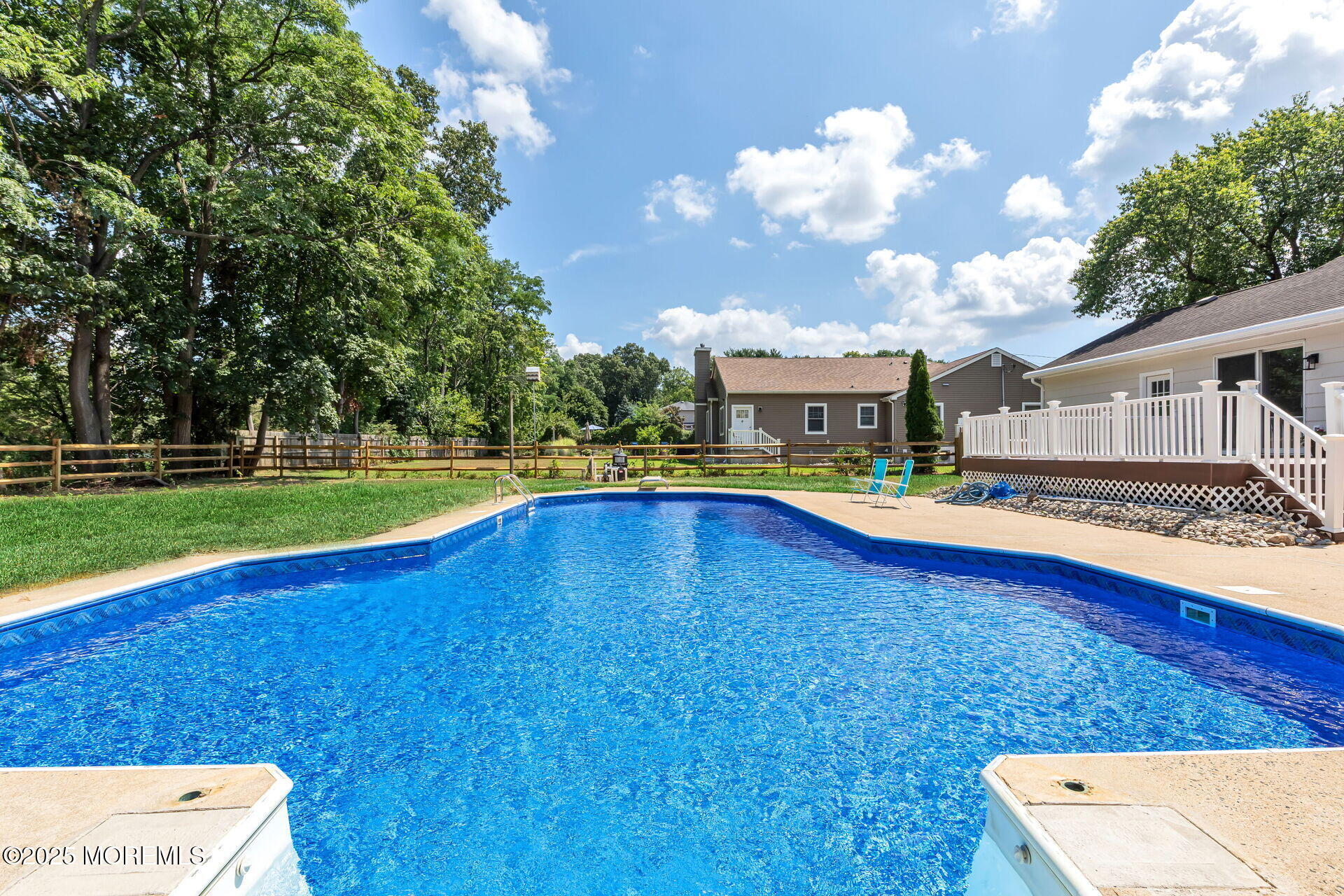 1276 West Front Street Lincroft, NJ 07738 - Photo 47 of 66 a view of a house with swimming pool and yard