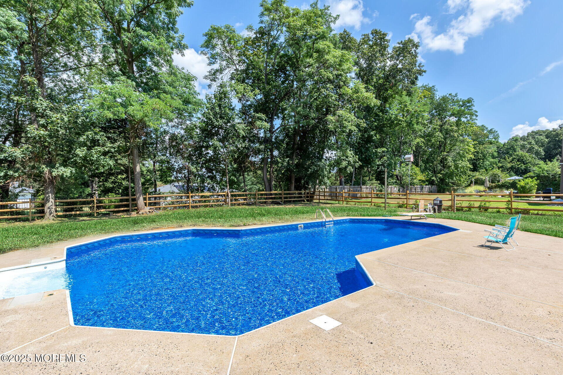 1276 West Front Street Lincroft, NJ 07738 - Photo 48 of 66 a view of a swimming pool with a yard