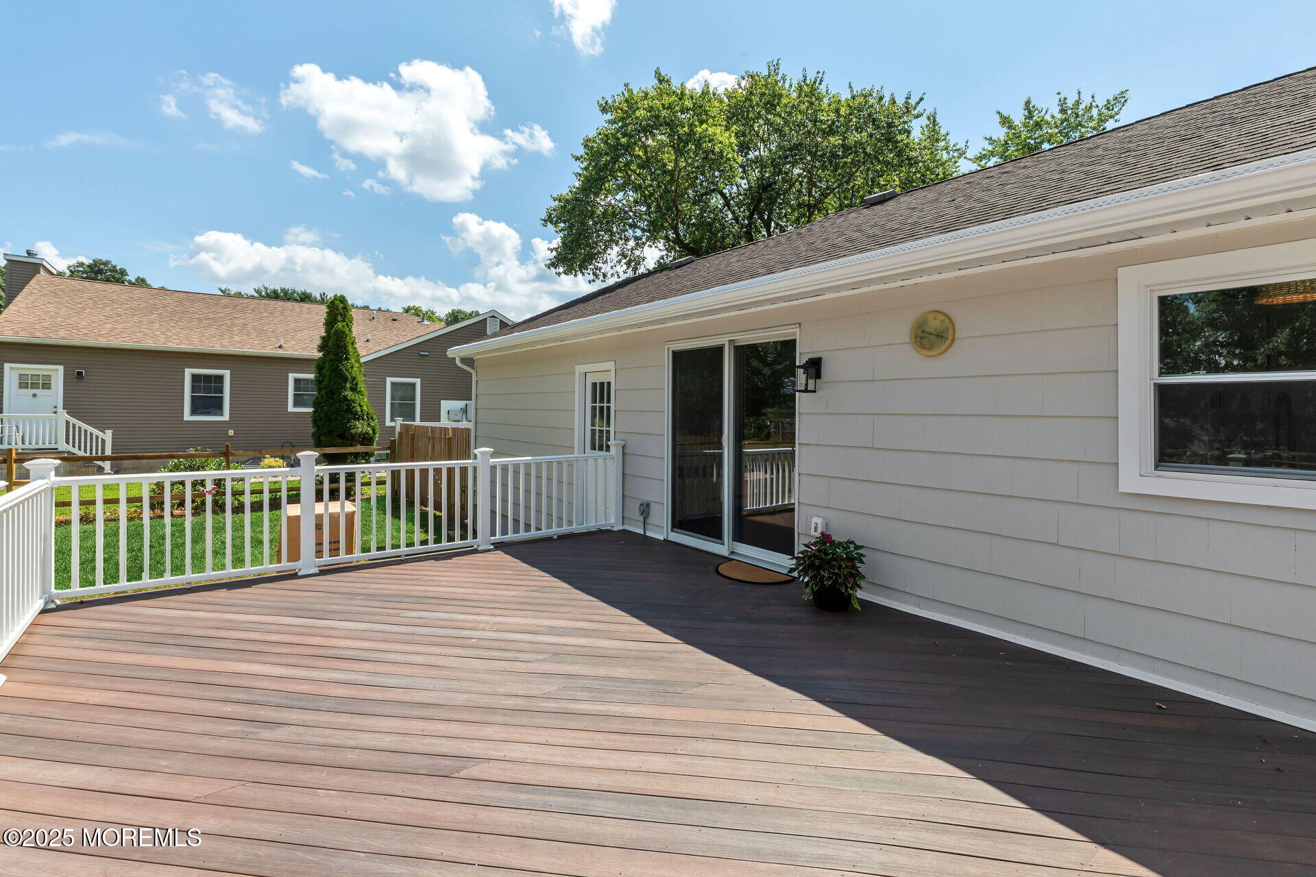 1276 West Front Street Lincroft, NJ 07738 - Photo 50 of 66 a view of a house with a wooden deck