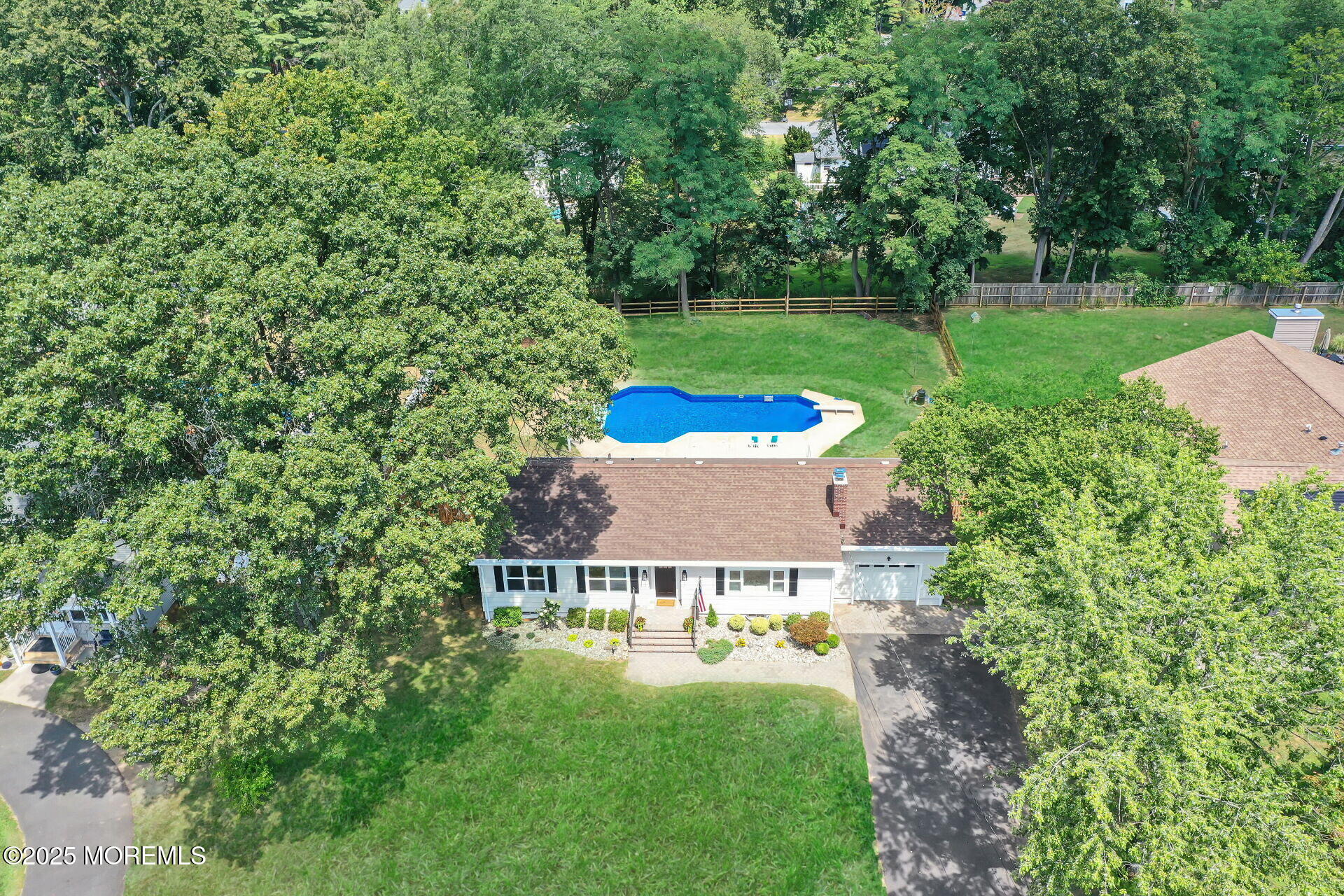1276 West Front Street Lincroft, NJ 07738 - Photo 55 of 66 a view of a house with a big yard potted plants and large tree
