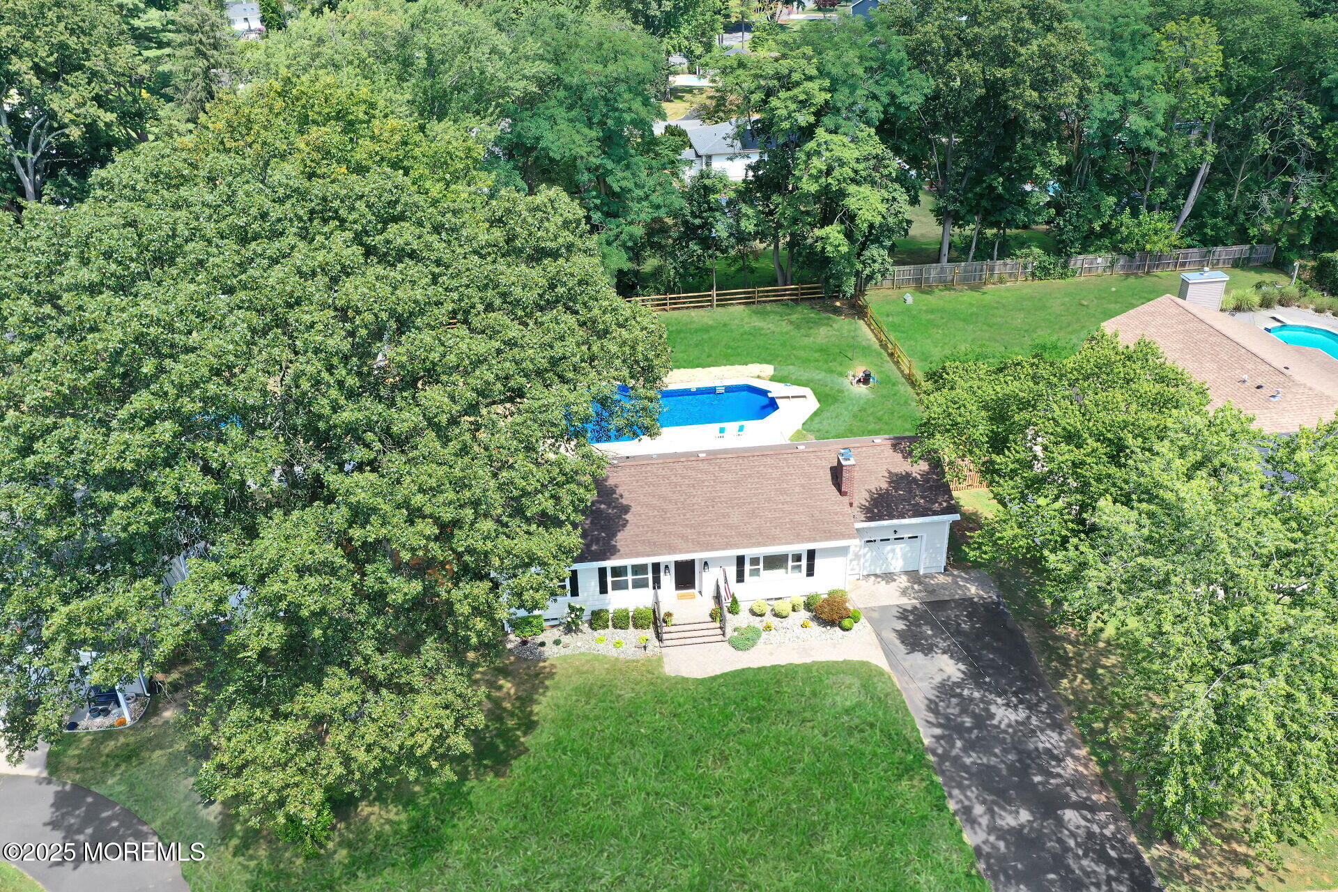 1276 West Front Street Lincroft, NJ 07738 - Photo 56 of 66 a view of a house with a yard and sitting area