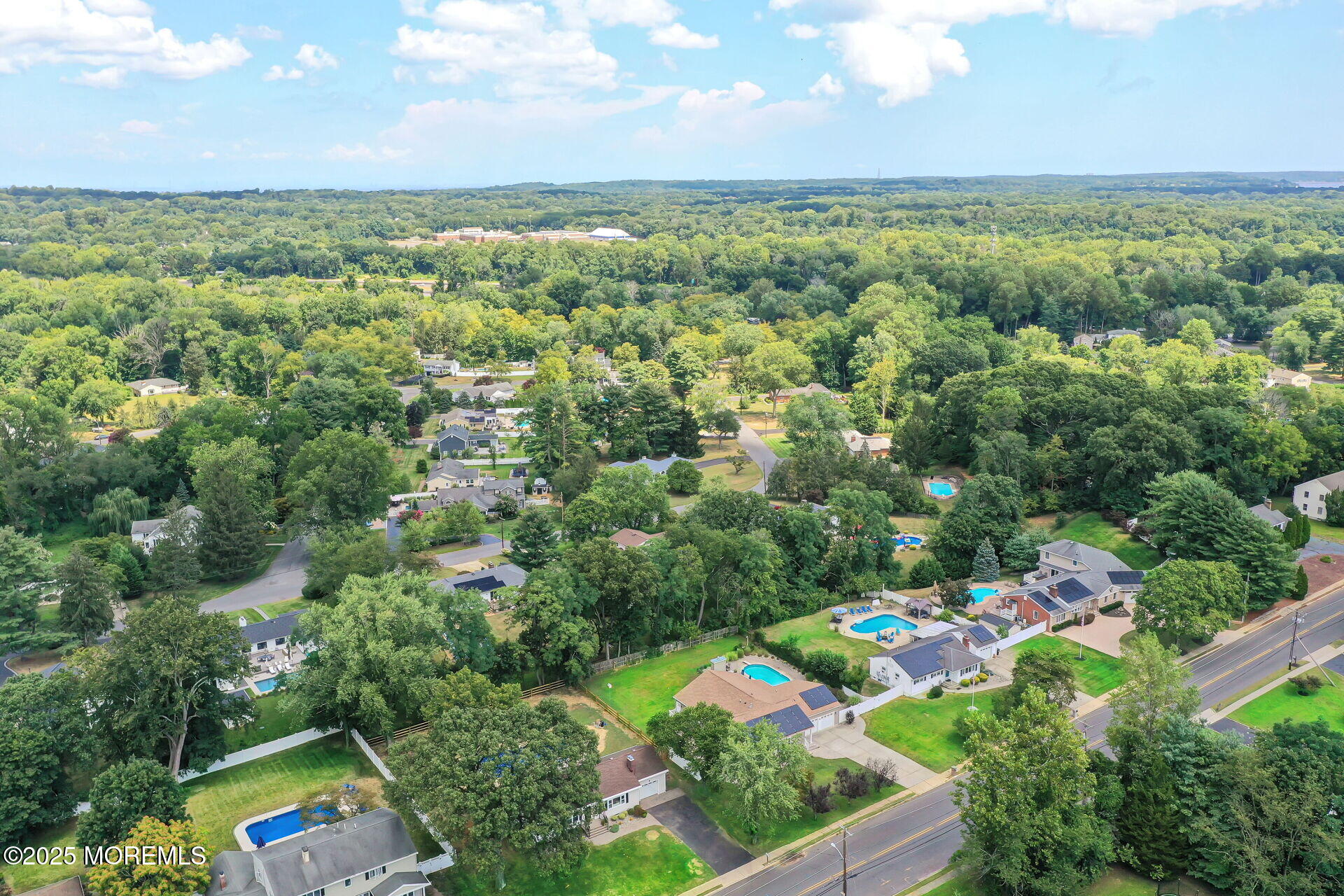 1276 West Front Street Lincroft, NJ 07738 - Photo 62 of 66 an aerial view of a houses with a yard