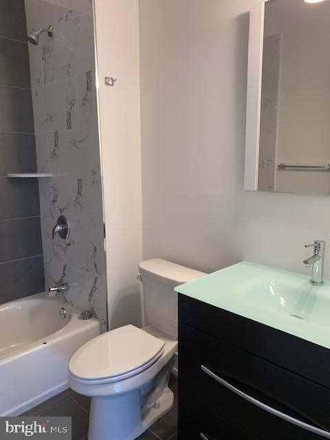 6162 Ridge Avenue, Unit 203 Philadelphia, PA 19128 - Photo 12 of 20 a bathroom with a sink a toilet and bathtub