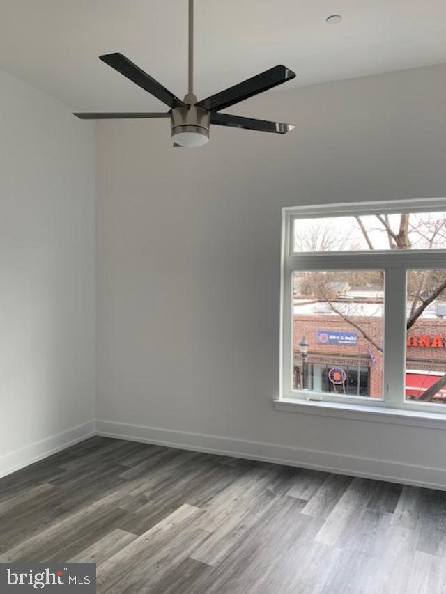 6162 Ridge Avenue, Unit 203 Philadelphia, PA 19128 - Photo 14 of 20 an empty room with wooden floor fan and windows
