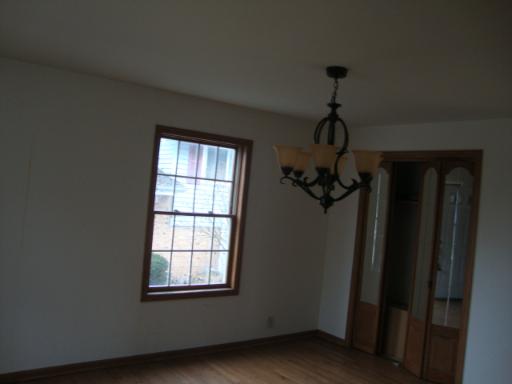 14443 Ridgeway Avenue Midlothian, IL 60445 - Photo 3 of 10 a view of a hallway with windows and chandelier