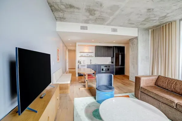 a living room with furniture and a flat screen tv