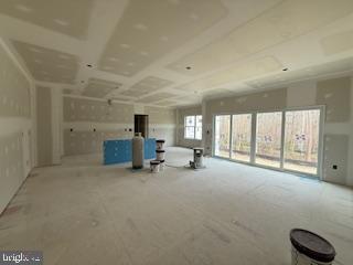 10417 Old Lawyers Road Unionville, VA 22567 - Photo 5 of 5 a big room with chandelier and windows